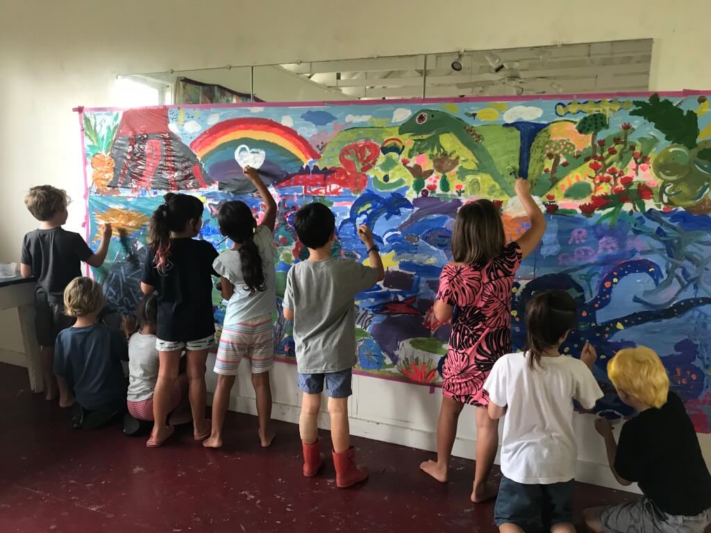 Children painting a wall